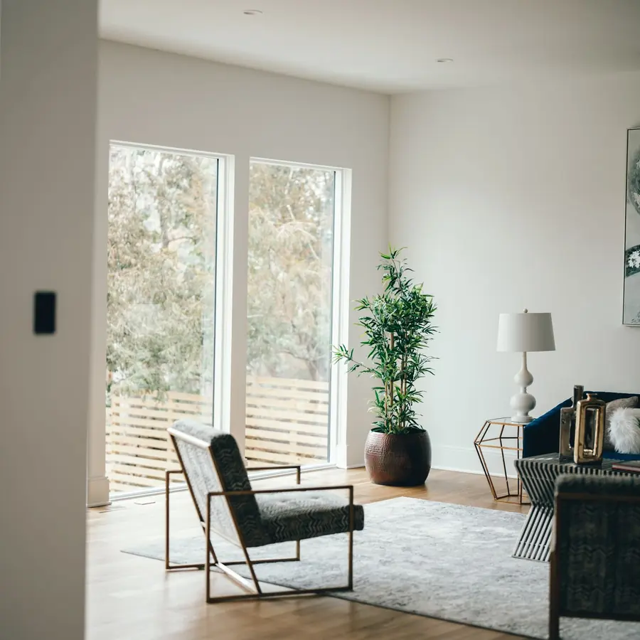 Bright, spotless living room with large windows after a house cleaning in Sarasota